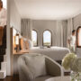 METT-Barcelona-Hotel-Duplex-Suite-Woman-Walking-Down-the-Stairs-Men-Looking-from-the-Window